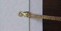 Add a gold eyelet